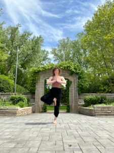Instructor Aime Bier performs a yoga pose at Rotary Botanical Gardens