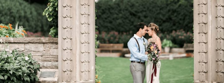 Newly married couple embraces in the Sunken Garden